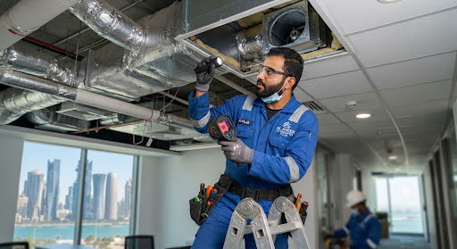 Doha AC repair engineer inspecting air ducts